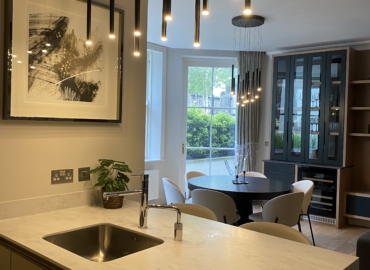 Contemporary kitchen and dining area showcasing thoughtful lighting and layout choices that inspire small room design ideas